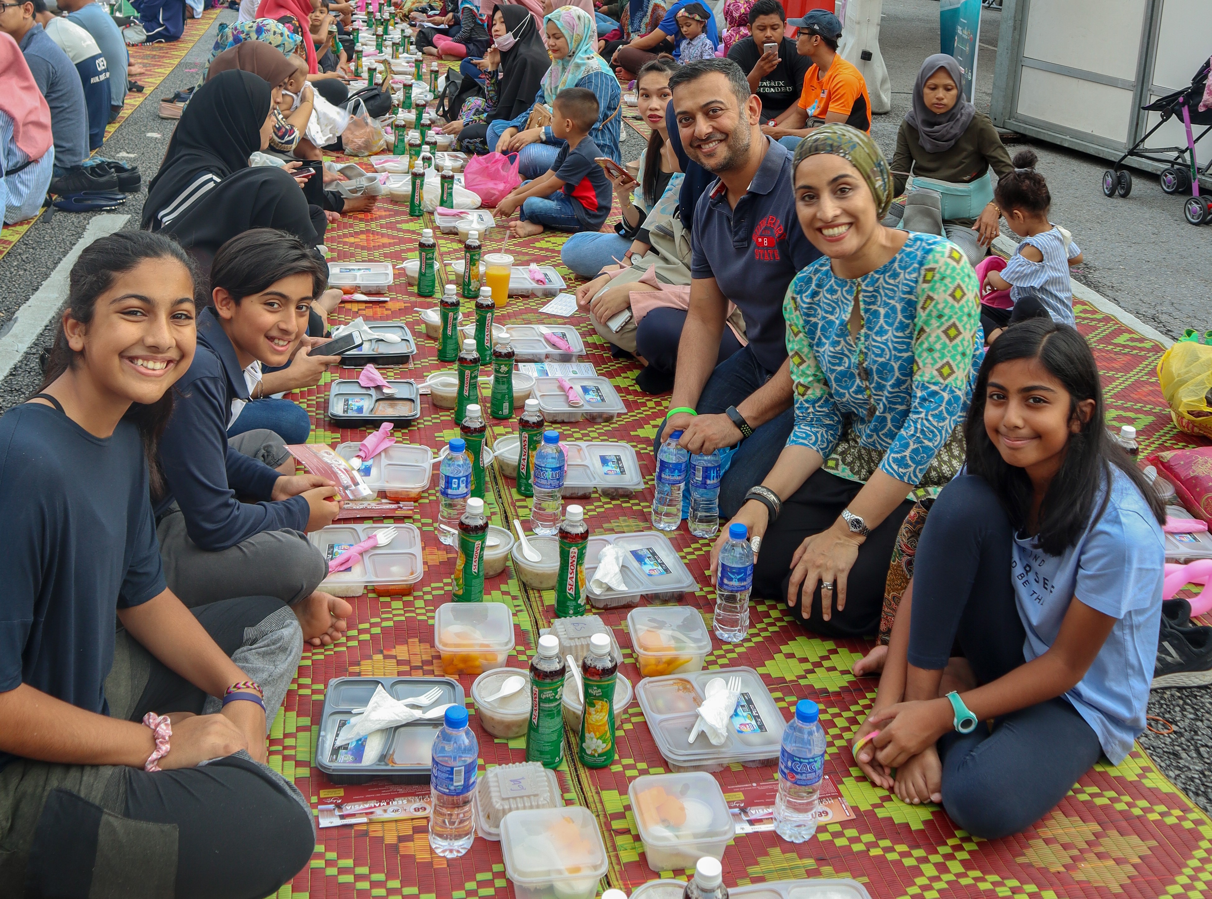 Andleen and her family break fast during the Iftar@KL in Merdeka Square