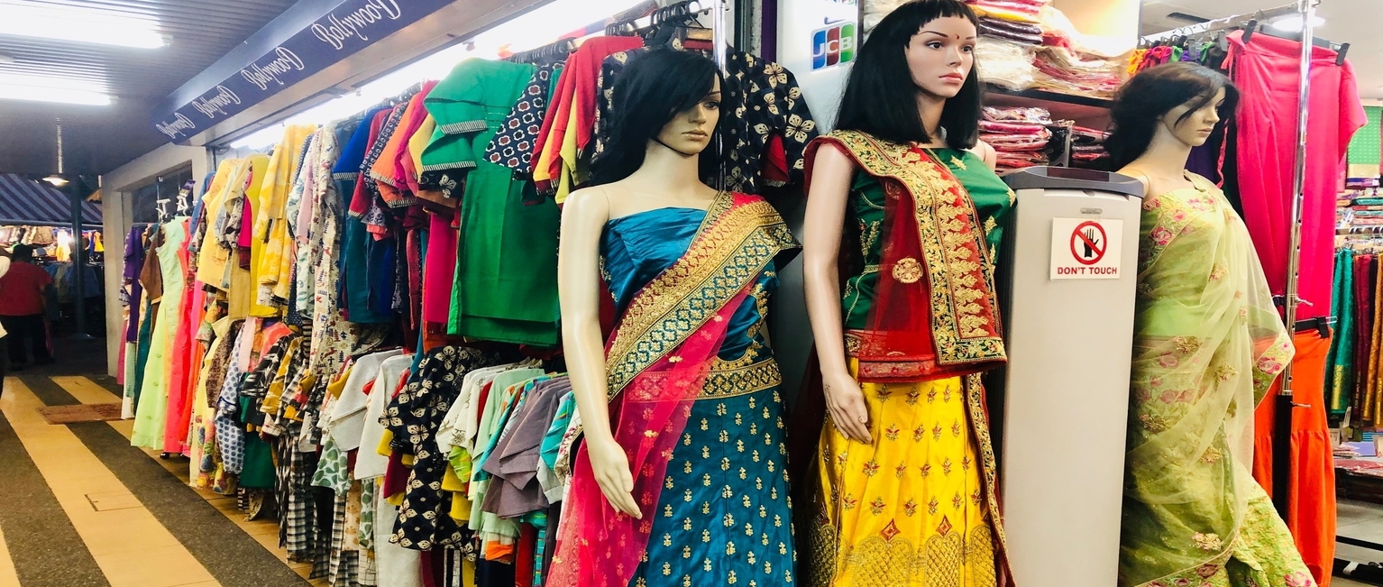 Brightly colored outfits in and outside the stores to choose from