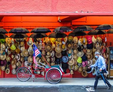Walking past a wall of hats 